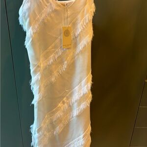 White Spaghetti strap dress. It could be worn for a bride to be, to a event.
